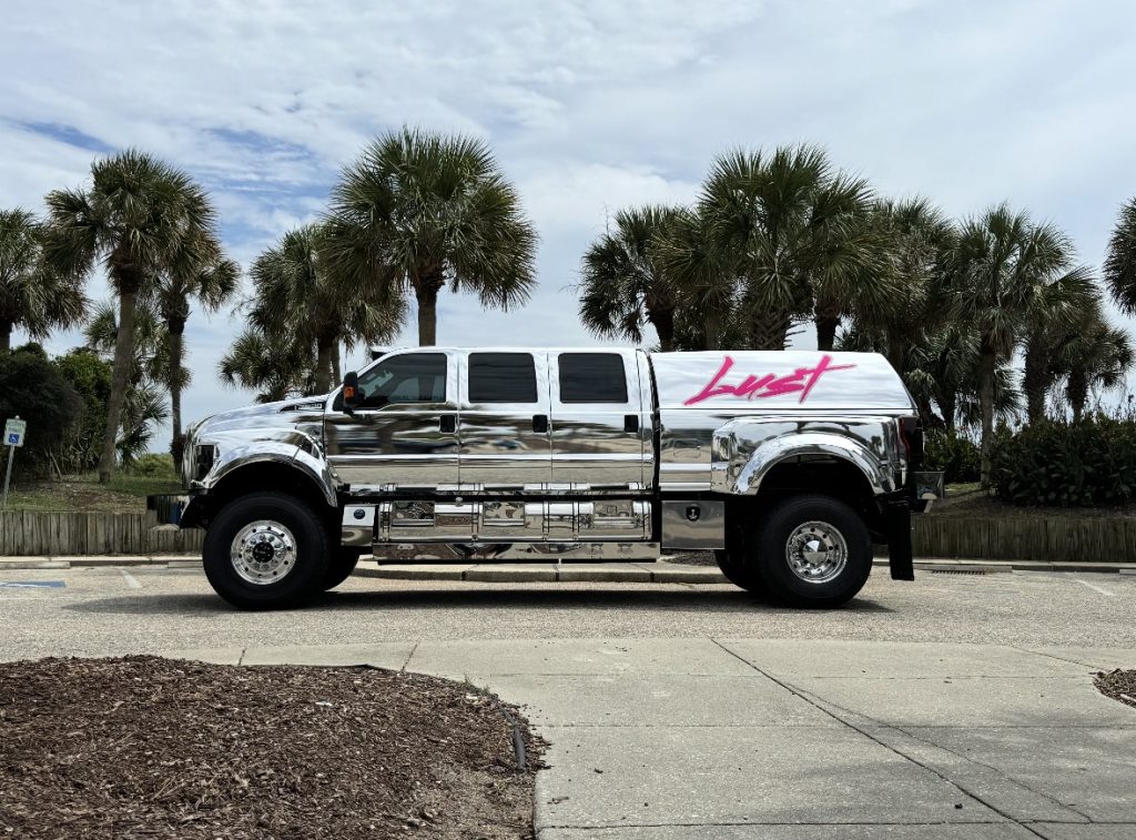 Chrome truck with Lust logo on the side.